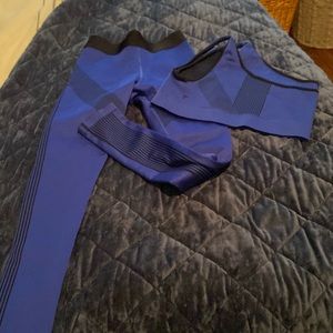 Fabletics athletic set size medium one shoulder blue and black seamless